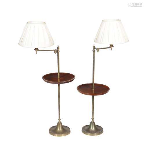 A pair of mahogany and brass standard lamp tables