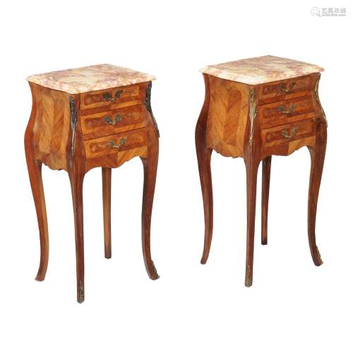 A pair of walnut and tulipwood bedside tables