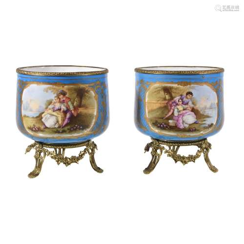 A pair of Sevres-style porcelain gilt-metal mounted jardinieres