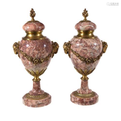A pair of striated rouge and white marble urns in Neoclassical taste