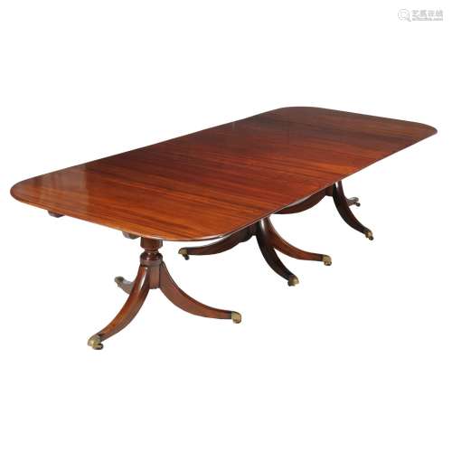 A mahogany triple pedestal dining table in Regency style