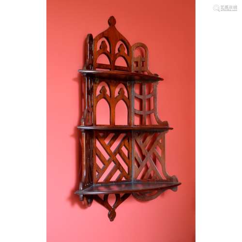 A flight of Victorian mahogany hanging wall shelves in Chinese Chippendale taste