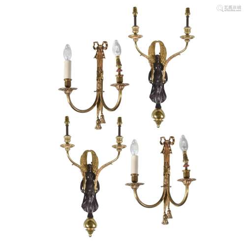 A pair of gilt and patinated twin light wall appliques in Empire taste