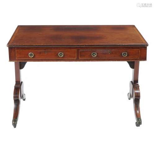 A Regency mahogany and rosewood banded library table