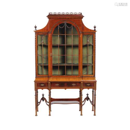 A mahogany cabinet on stand in 18th century style