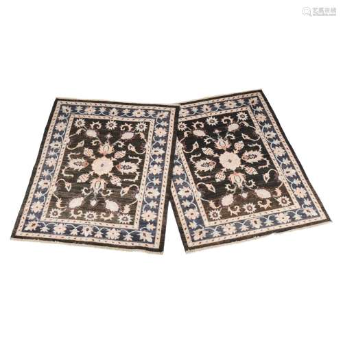 A pair of woven rugs