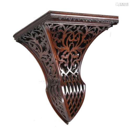 A Victorian carved and stained walnut wall bracket