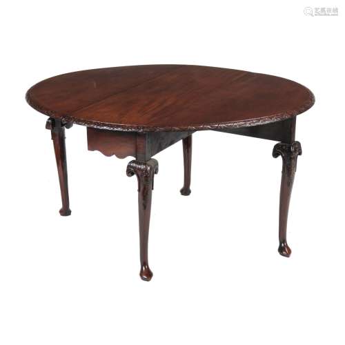 A mahogany drop leaf table in George II style