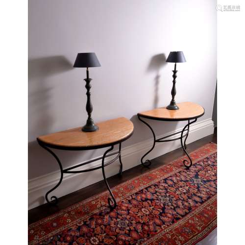 A pair of wrought iron and Sienna marble mounted console tables