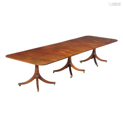 A mahogany dining table in late George III style