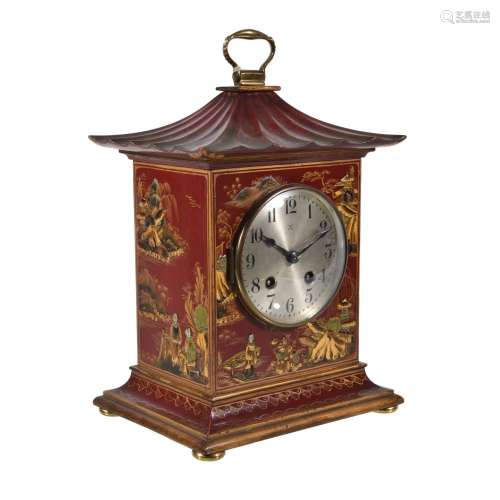 A red lacquered bracket clock