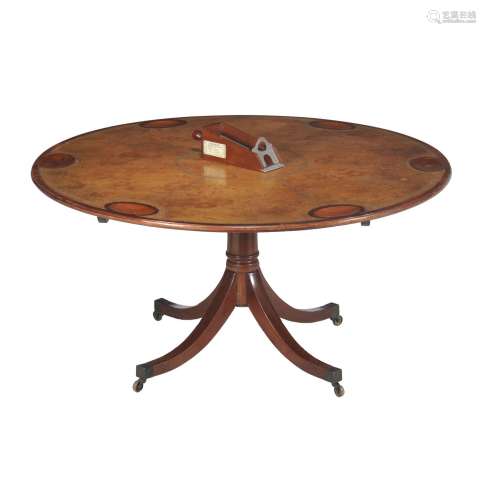 A mahogany and gilt tooled leather inset pedestal games table