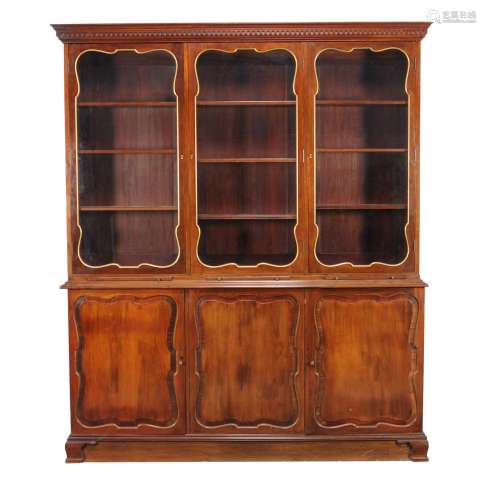 A French mahogany and parcel gilt cabinet bookcase