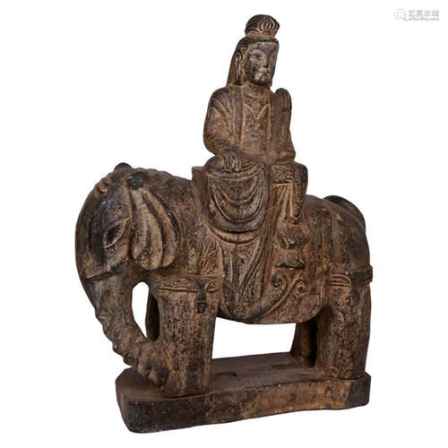 Carved black stone buddha on an elephant