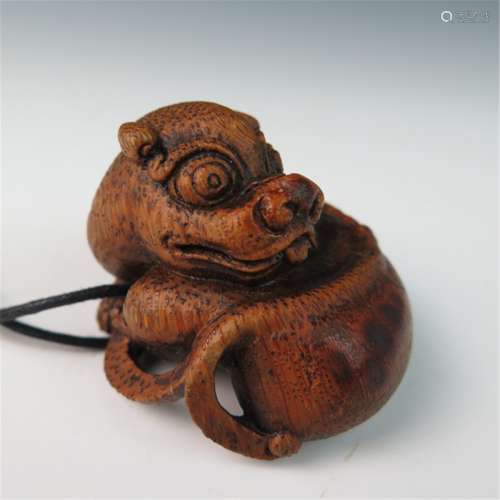 A carved bamboo dog