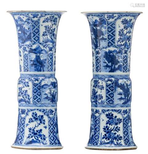 A fine pair of blue and white porcelain Gu vases, the roundels decorated with various landscapes and flower branches, Kangxi and period, H 51,5 - 52 cm