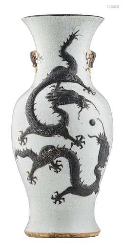 A Chinese relief decorated stoneware vase with a crane and two dragons playing with a flaming pearl, marked, about 1900, H 45 cm