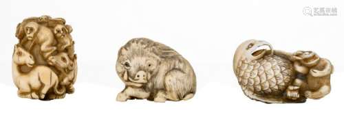 Three Japanese early Meiji period ivory netsuke depicting a wild boar, a raptor with a monkey and a pandemonium of various animals, black coloured engraving, two items signed, H 3,4 - W 4,2 (boar) - H 5,1 - W 3,2 (raptor) - H 4,4 - W 3,2 cm (pandemonium)