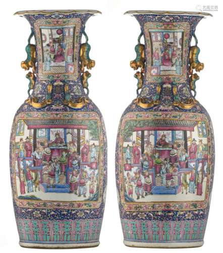 A fine pair of Chinese blue ground famille rose floral and relief decorated vases, the roundels with warriors and court scenes, 19thC, H 89,5 cm