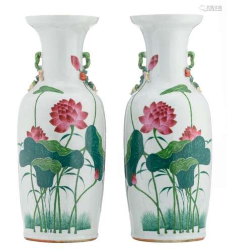 A pair of Chinese famille rose vases with lotus and calligraphic texts, the handles relief decorated, H 59,5 cm