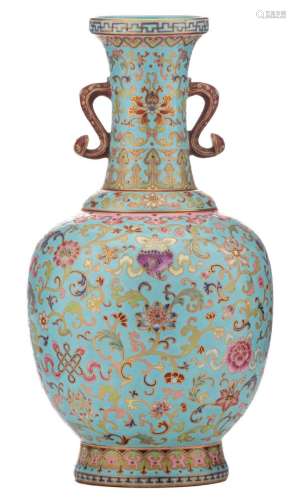 A fine Chinese turquoise ground famille rose bottle vase, overall decorated with scrolling lotus and Buddhistic symbols, the handles ruyi shaped, with a Qianlong mark, H 35 cm