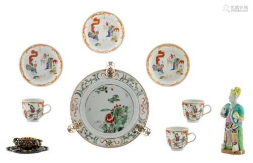 A various Chinese famille rose, famille verte and iron red and gilt decorated porcelain, the dish with silver mount, 18th / 19thC; added a Chinese relief decorated gilt and patinated brass cup and saucer, H 4 - 17,5 cm