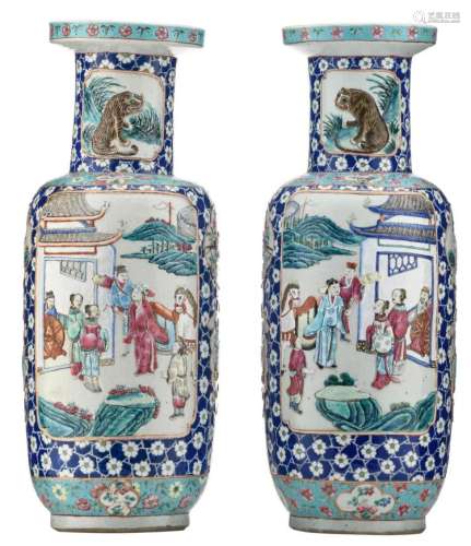 A fine pair of Chinese blue ground famille rose floral and relief decorated vases, the roundels with animated scenes, various animals and flower branches, H 60,5 cm