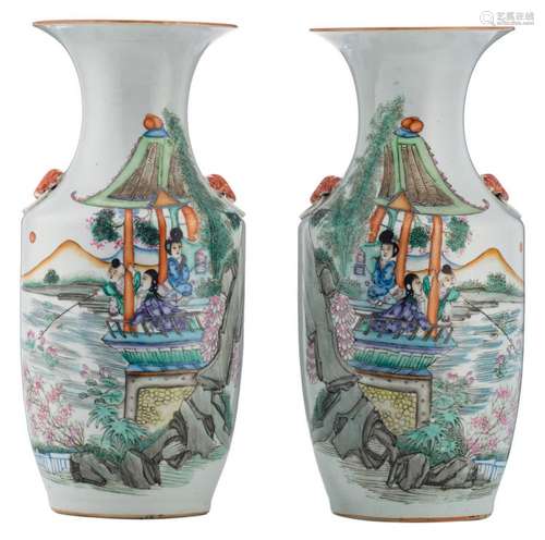 A pair of Chinese polychrome decorated vases with figures in a pavilion and calligraphic texts, H 43,5 cm