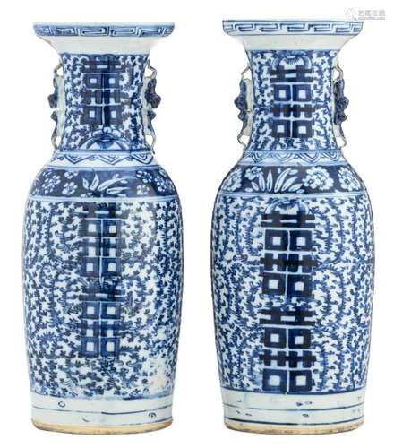 A pair of Chinese blue and white vases, decorated with scrolling leaves and Xi marks, H 57 cm