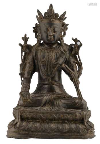 A Chinese bronze seated Buddha, with traces of polychromy, 18th / 19thC, H 28,1 cm