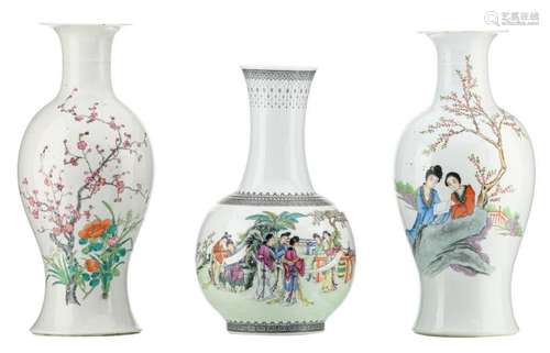 Two Chinese famille rose baluster shaped vases, decorated with two ladies in a garden, flower branches and calligraphic texts; added a ditto vase, decorated with a gallant garden scene, marked, H 40 - 45 cm