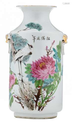 A Chinese famille rose vase, decorated with a crane, flower branches and calligraphic texts, marked, H 29,5 cm