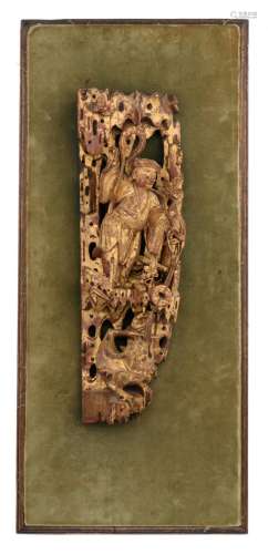 A Chinese carved guilt wood fragment, depicting an Immortal, about 1900, H 36,5 - W 12 - D 8,5 cm