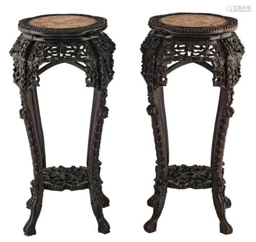 A pair of Chinese richly carved hardwood stands with marble top, H 93 cm