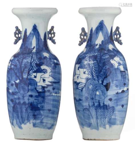 Two Chinese pale celadon ground blue and white vases, decorated with a village in a mountainous river landscape, H 58 cm