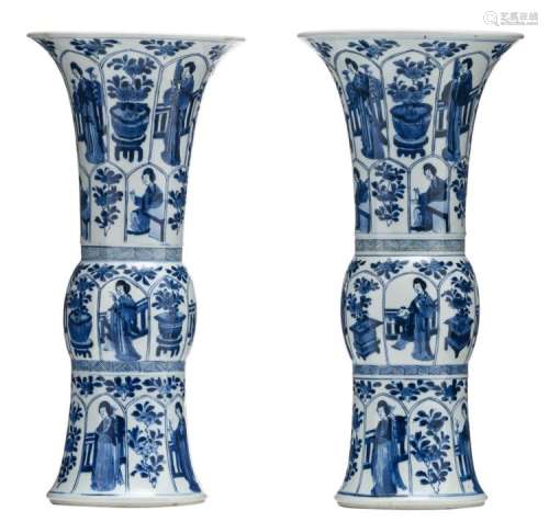 A pair of Chinese blue and white decorated Kangxi Gu vases, the roundels with court ladies and flower branches, with a Jiajing mark, H 45 cm