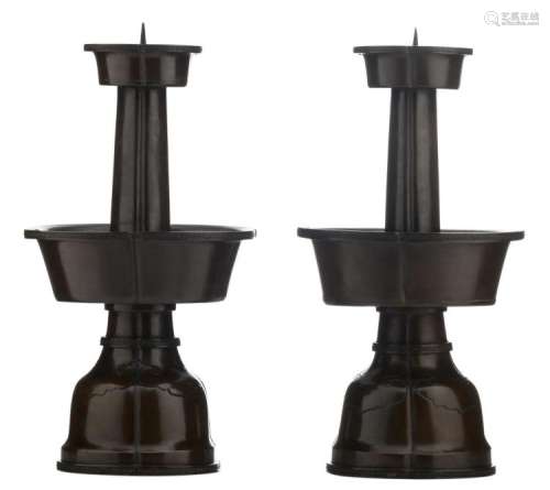 A pair of Chinese bronze pricket candlesticks with lotus shaped elements and key pattern friezes, 17th / 18thC, H 50 cm