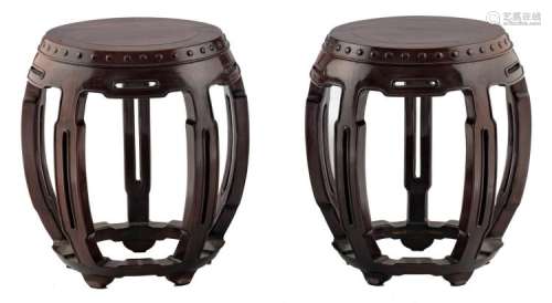 A pair of Chinese carved exotic hardwood garden seat shaped stools, H 46 cm