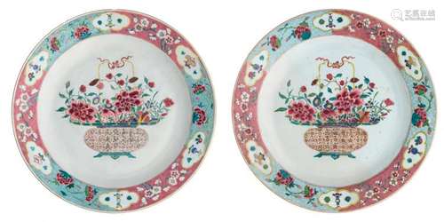 Two Chinese famille rose floral decorated export porcelain plates, the well with a flower basket, ø 43 - 43,5 cm