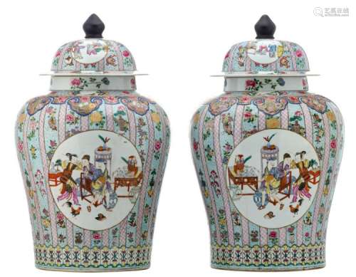 A pair of Chinese famille rose floral decorated vases and covers, the roundels with animated scenes, H 62 cm