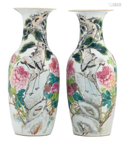 A pair of Chinese famille rose vases, decorated with cranes on rocks, flower branches and calligraphic texts, H 60,5 cm