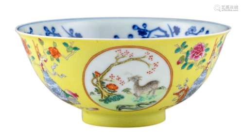 A Chinese yellow ground incised blue and white and famille rose bowl, the roundels decorated with goats in a landscape, marked Daoguang, H 6,5 - ø 15 cm