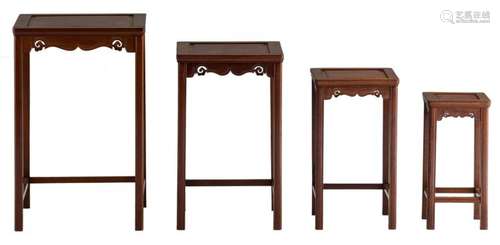 A Chinese four-piece set of carved hardwood nest tables, H 40 - 62 - W 19,5 - 40D 19 - 40 cm