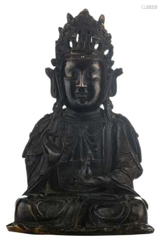 A Chinese Ming bronze seated Buddha, with traces of polychromy, H 31,5 cm