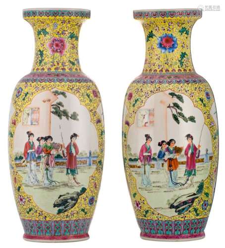 A pair of Chinese yellow ground famille rose floral decorated vases, the roundels with gallant garden scenes, marked, H 62,5 cm