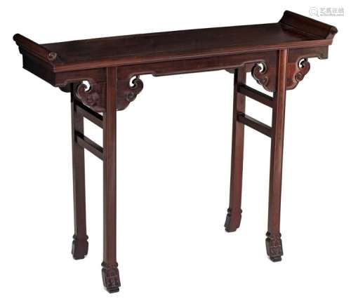 A Chinese carved hardwood side table, H 93,3 - W 120 - D 38 cm
