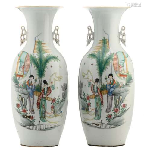 A pair of Chinese famille rose vases, decorated with two court ladies in a garden and calligraphic texts, H 58 - 58,5 cm