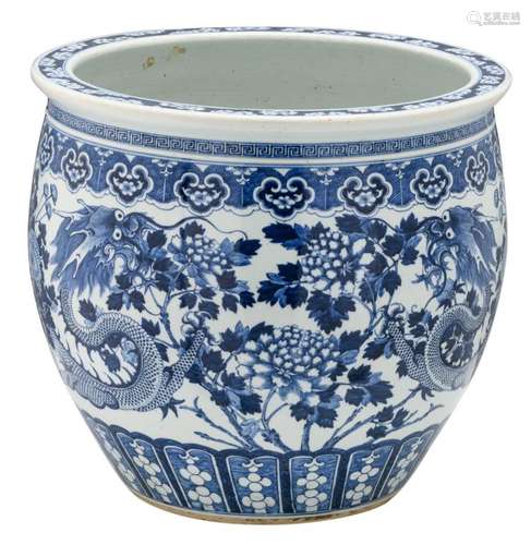 A Chinese blue and white jardiniere decorated with dragons and flower branches, 19thC, H 46,5 - ø 53 cm