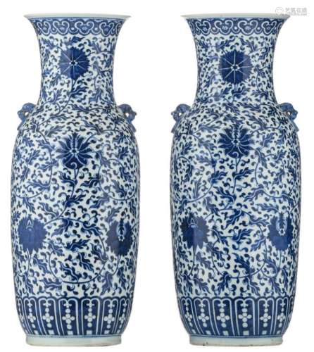 A pair of Chinese blue and white vases, decorated with scrolling lotus, H 61 cm