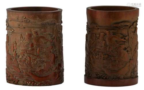 Two Chinese carved bamboo brushpots, depicting the Eight Immortals, H 16 - 16,5 cm